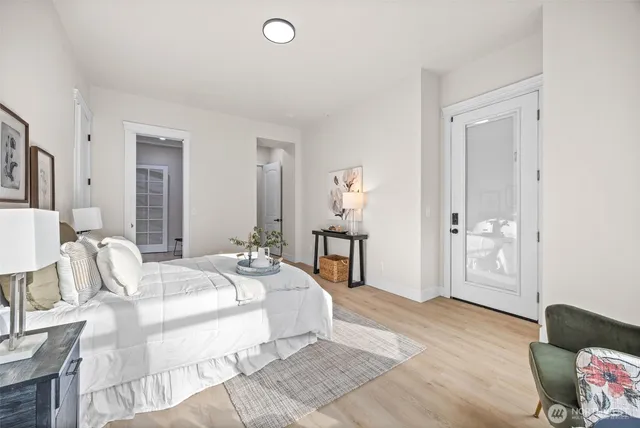 a bedroom with a bed and a chair