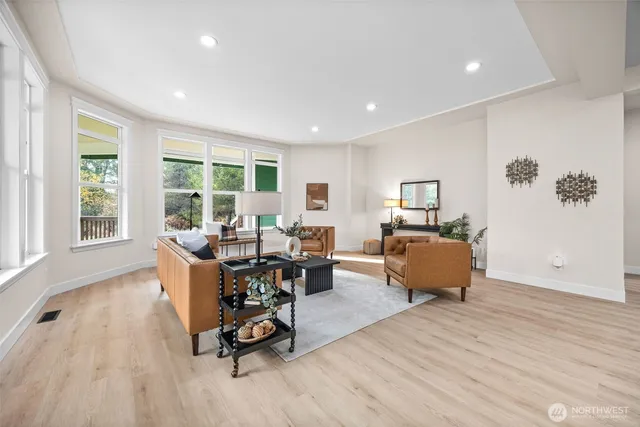 a living room with furniture window and wooden floor
