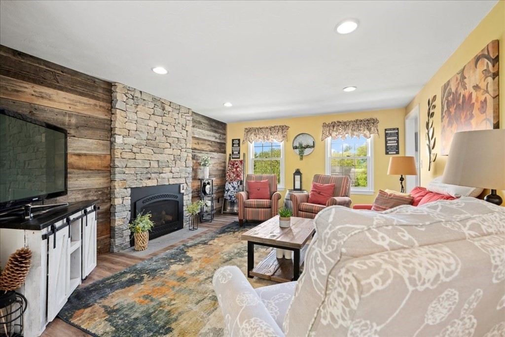 271 Marston Road Northbridge, MA 01588 - Photo 8 of 40 a living room with furniture flat screen tv and a fireplace