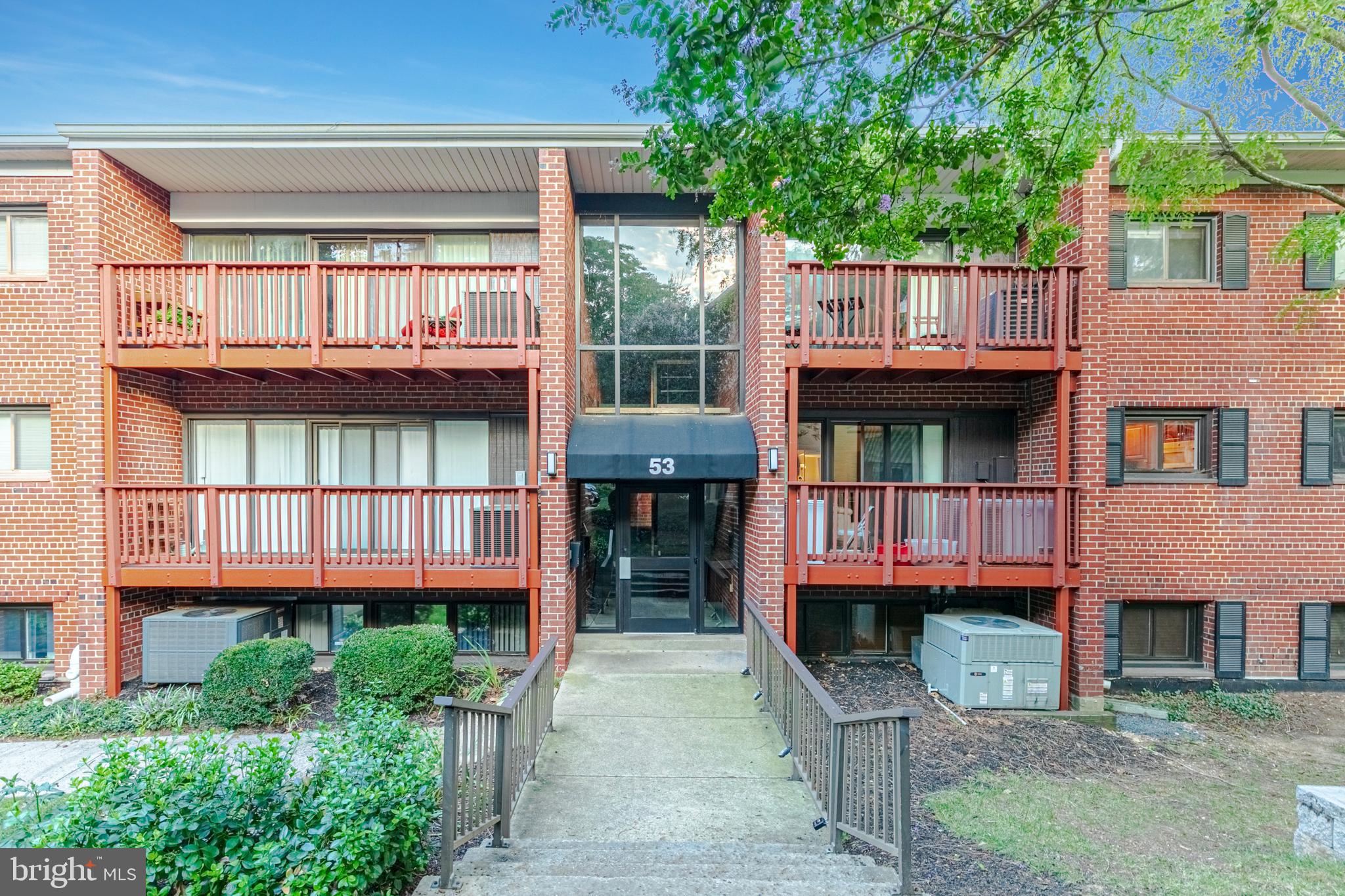 53 Skyhill Road, Unit 303 Alexandria, VA 22314 - Photo 21 of 22 front view of a house with a balcony