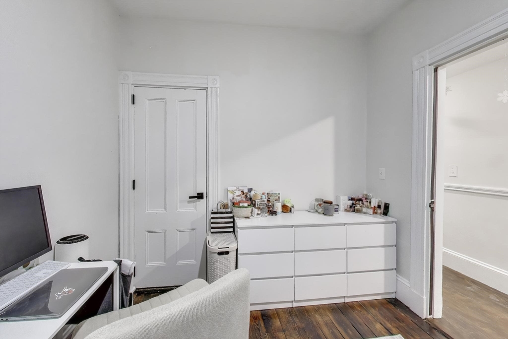 65 Lambert Avenue Boston, MA 02119 - Photo 14 of 42 a room with a couch and a window