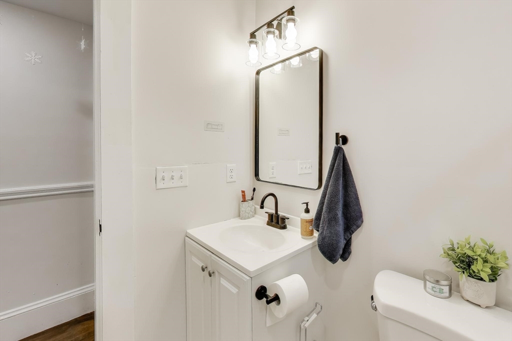 65 Lambert Avenue Boston, MA 02119 - Photo 16 of 42 a bathroom with a sink and a mirror