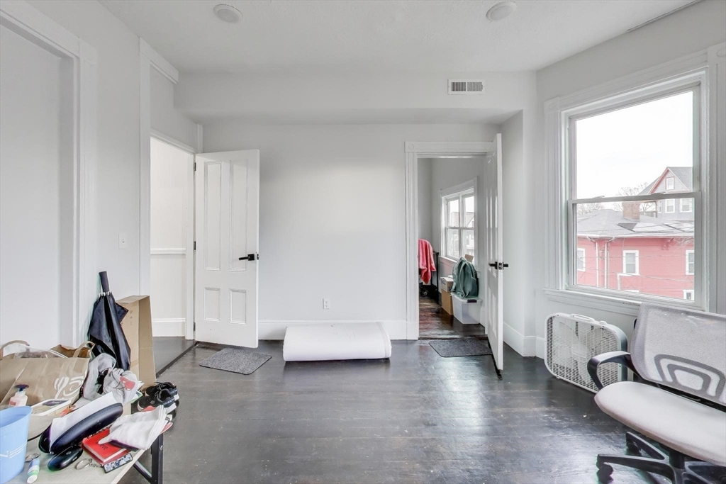 65 Lambert Avenue Boston, MA 02119 - Photo 29 of 42 a view of a room with gym equipment