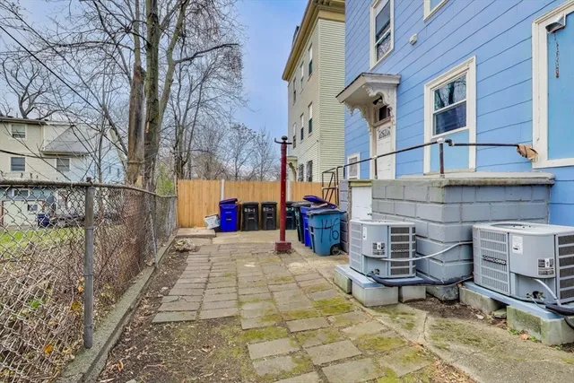 a view of a brick building with many windows