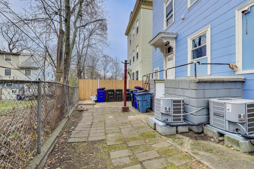 65 Lambert Avenue Boston, MA 02119 - Photo 41 of 42 a view of a brick building with many windows