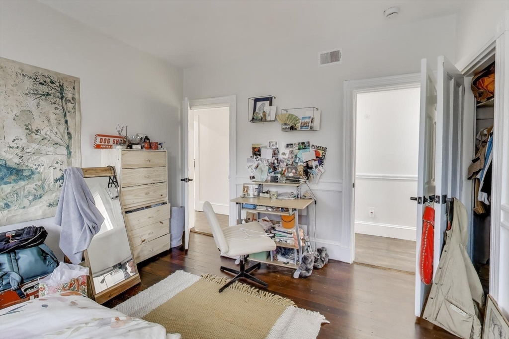 65 Lambert Avenue Boston, MA 02119 - Photo 10 of 42 a view of a workspace with furniture and toys