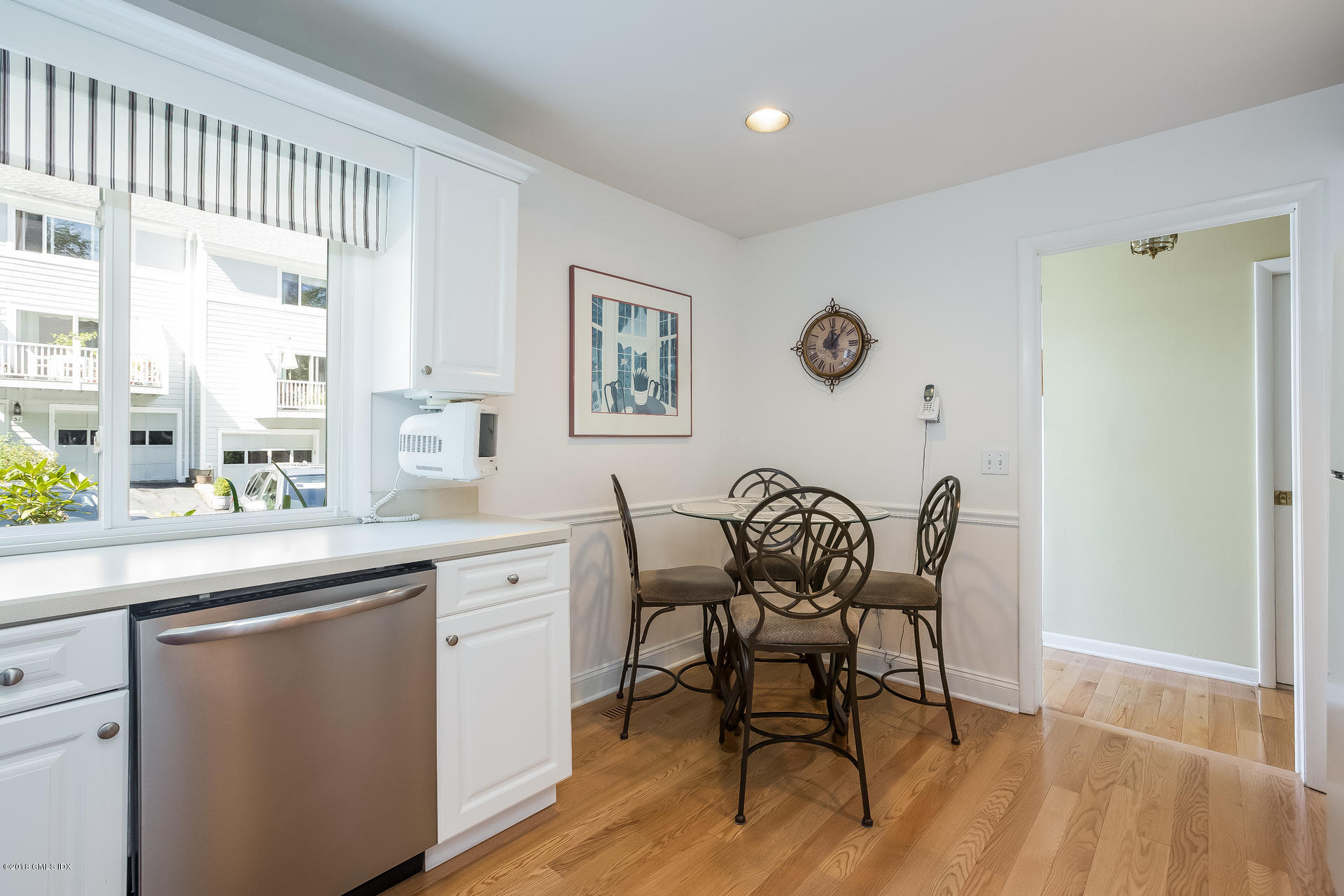 52 Stirrup Lane, Unit 52 Riverside, CT 06878 - Photo 9 of 30 a dining room with furniture and window