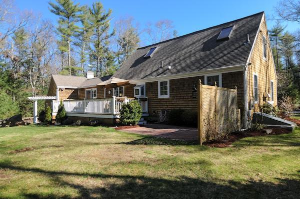 435 Walnut Plain Road Rochester, MA 02770 - Photo 2 of 8 a view of a house with yard and sitting area