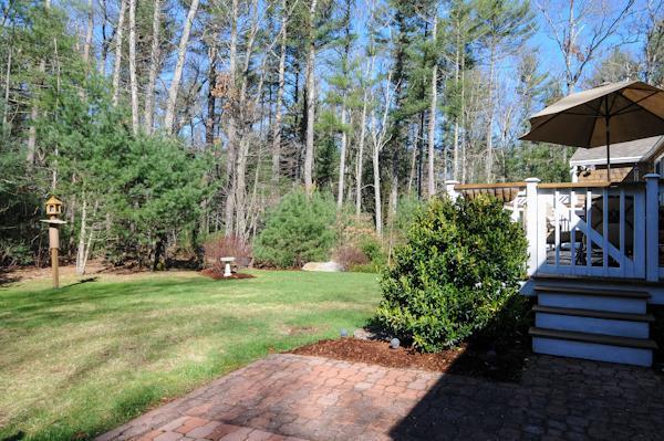 435 Walnut Plain Road Rochester, MA 02770 - Photo 4 of 8 a view of a backyard with sitting area