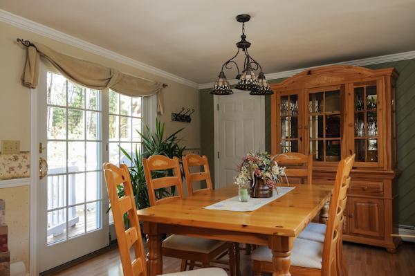 435 Walnut Plain Road Rochester, MA 02770 - Photo 7 of 8 a view of a dining room with furniture window and wooden floor