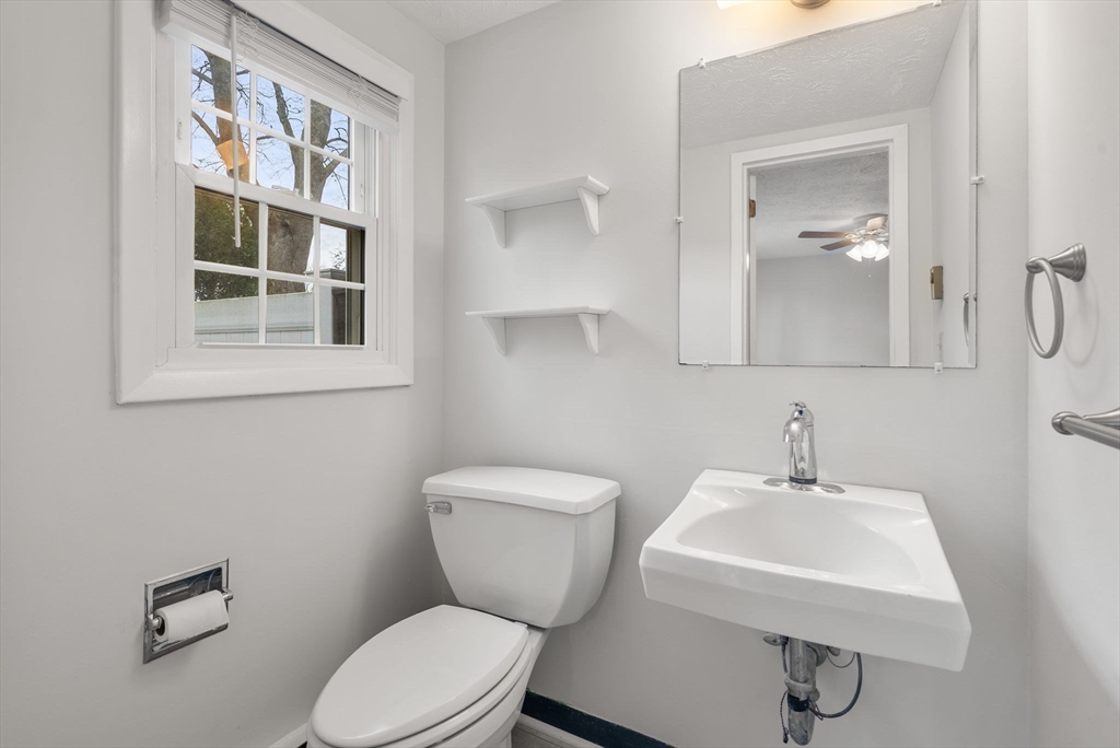 6 Keegan Lane, Unit E Greenfield, MA 01301 - Photo 15 of 29 a bathroom with a toilet a sink and mirror
