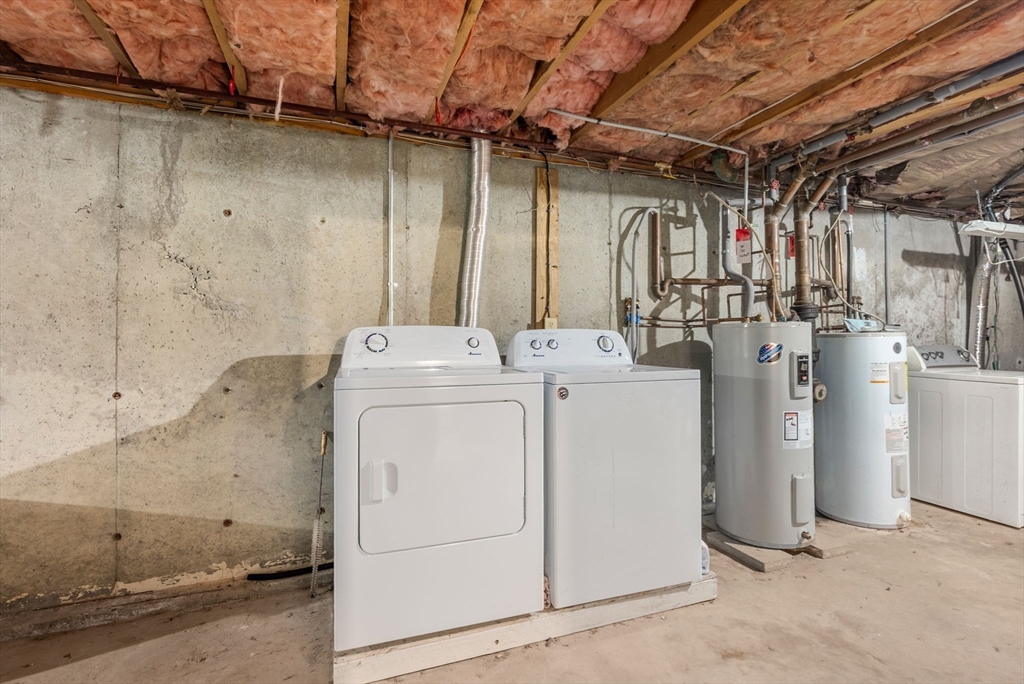 6 Keegan Lane, Unit E Greenfield, MA 01301 - Photo 21 of 29 a utility room with dryer and washer
