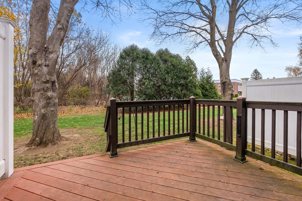 6 Keegan Lane, Unit E Greenfield, MA 01301 - Photo 23 of 29 a view of a deck with a yard