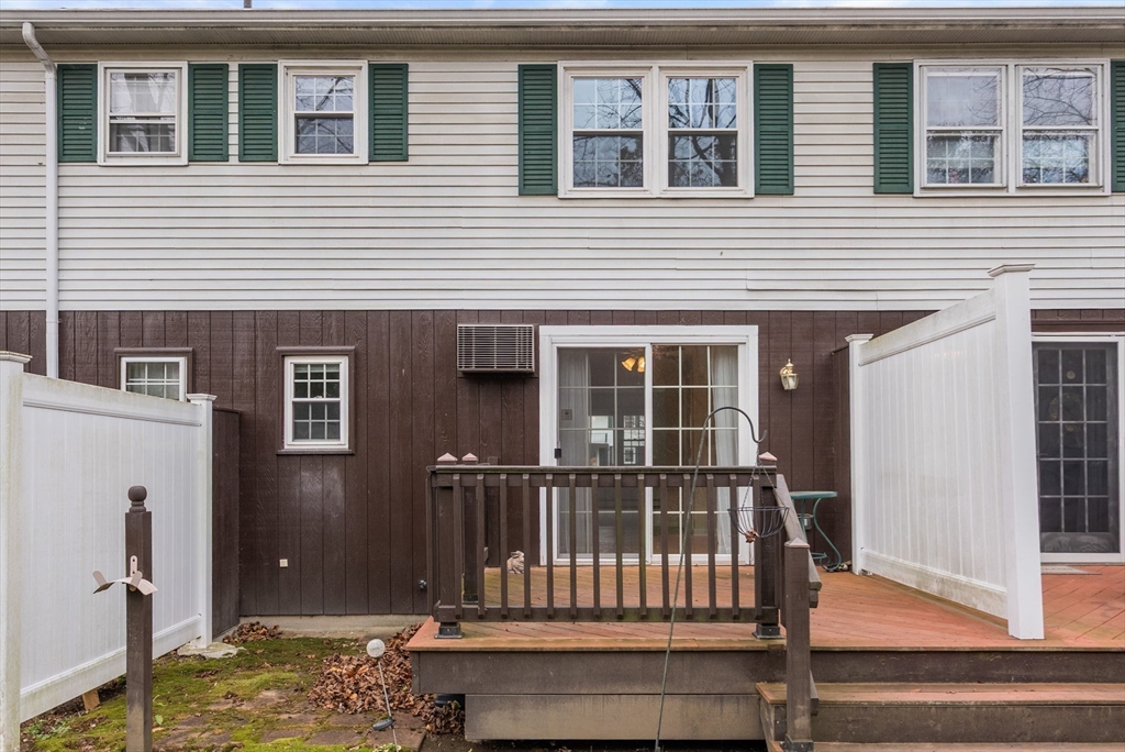 6 Keegan Lane, Unit E Greenfield, MA 01301 - Photo 24 of 29 a view of wooden house and a small yard