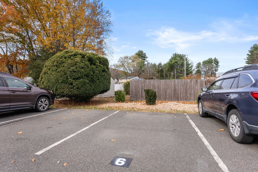 6 Keegan Lane, Unit E Greenfield, MA 01301 - Photo 28 of 29 a view of a car parked in front of a house