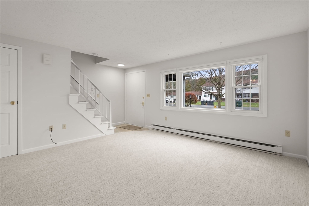 6 Keegan Lane, Unit E Greenfield, MA 01301 - Photo 4 of 29 a view of an empty room with a window