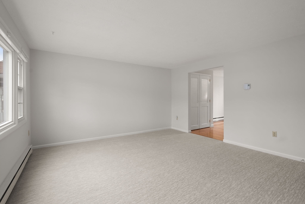 6 Keegan Lane, Unit E Greenfield, MA 01301 - Photo 6 of 29 a view of an empty room with a window