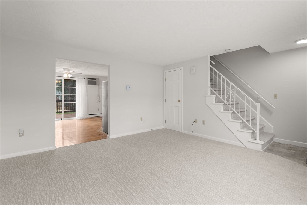 6 Keegan Lane, Unit E Greenfield, MA 01301 - Photo 7 of 29 a view of an empty room with chandelier fan