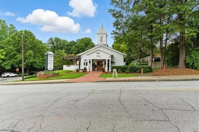 a view of house with yard and entertaining space