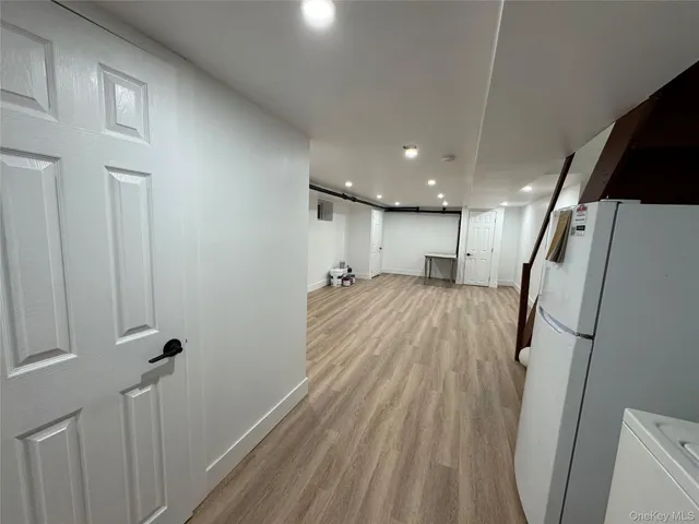 a view of a room with wooden floor and sink