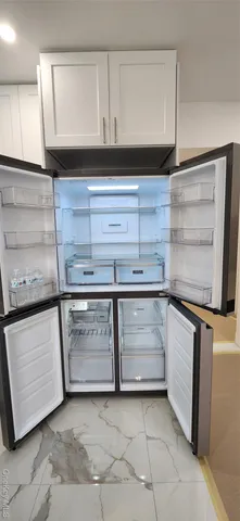 a kitchen with granite countertop a stove and a sink