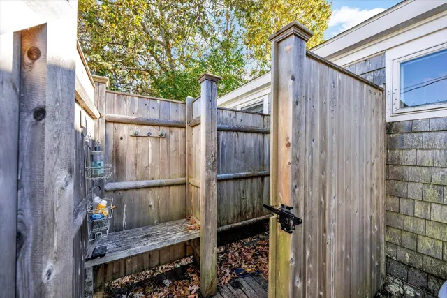 a view of a house with a yard covered in snow