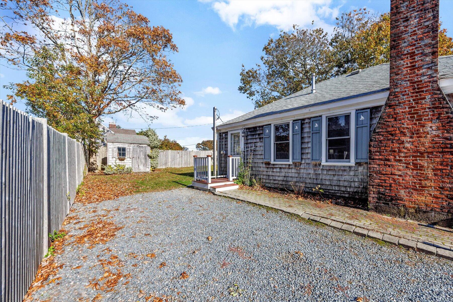 2 Rita Mary Street West Dennis, MA 02670 - Photo 12 of 39 a view of a house with a yard covered in snow