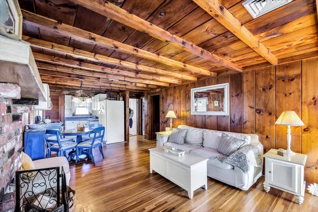 a living room with lots of furniture and a chandelier