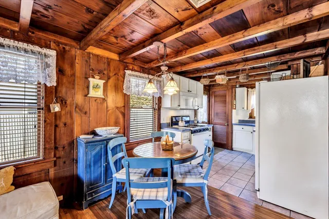 a kitchen with stainless steel appliances granite countertop a stove and a refrigerator