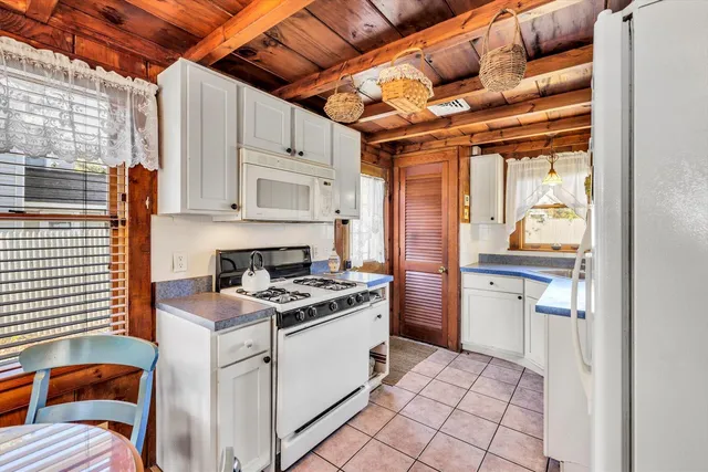 a kitchen with a stove and a sink
