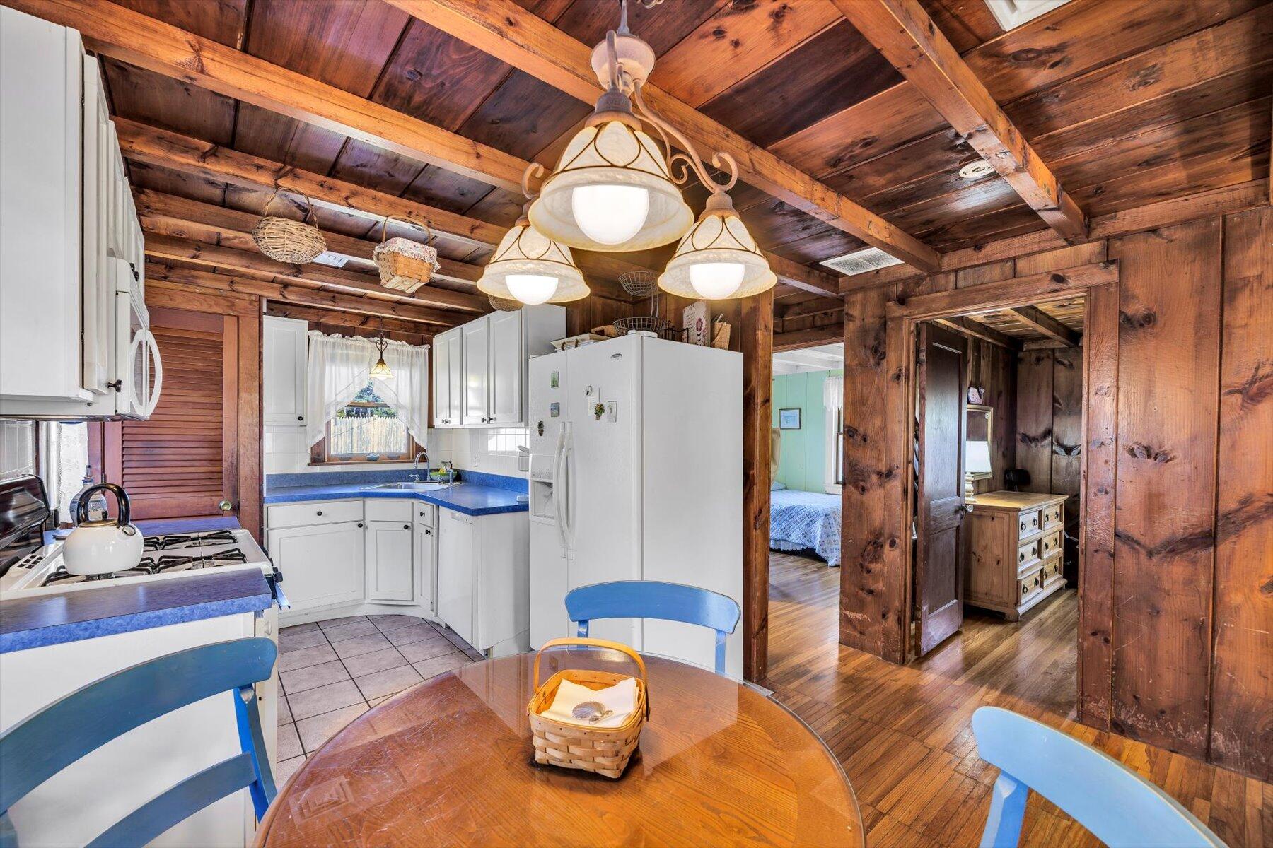 2 Rita Mary Street West Dennis, MA 02670 - Photo 20 of 39 a view of a dining room with furniture and a chandelier