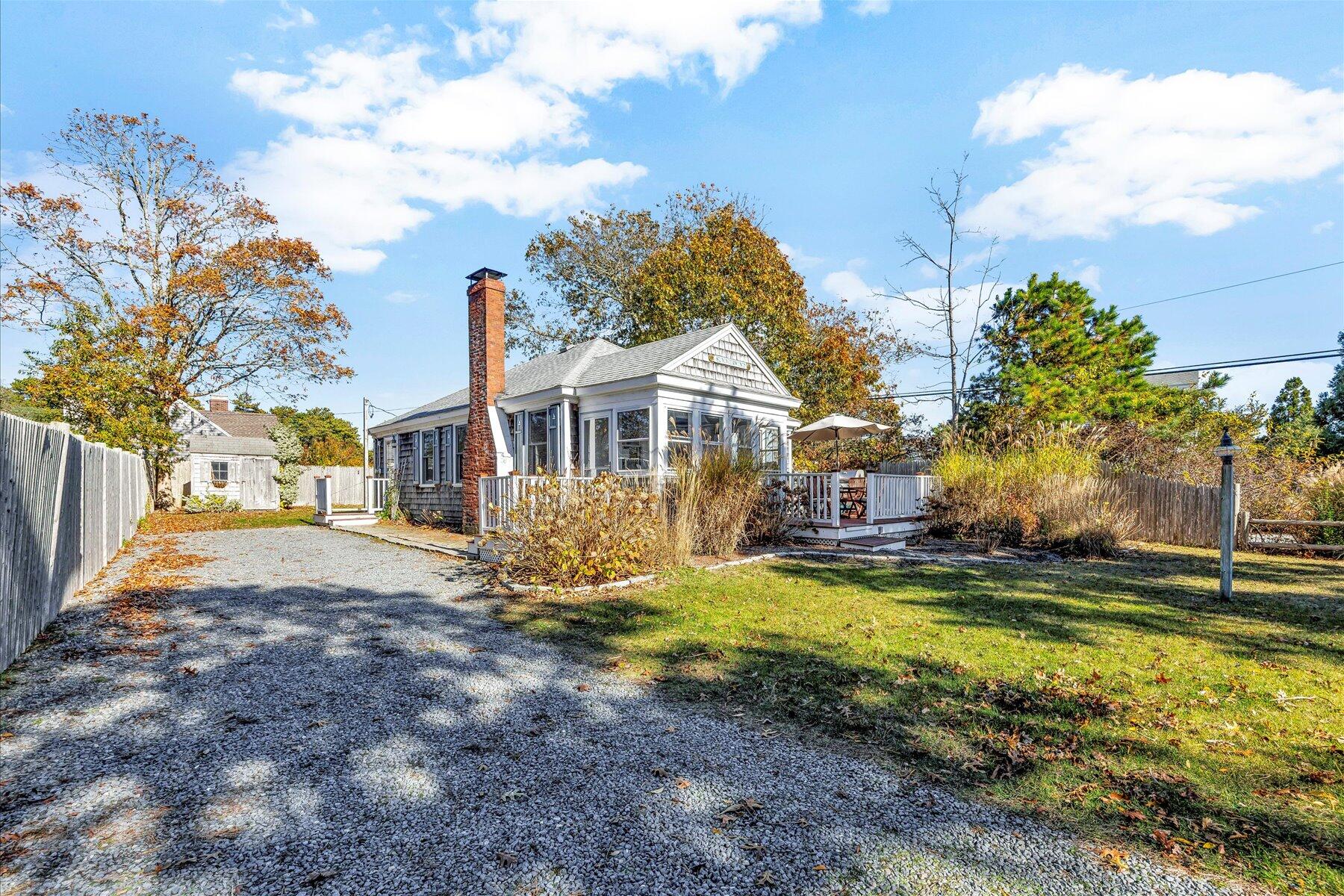 2 Rita Mary Street West Dennis, MA 02670 - Photo 2 of 39 a view of a house with a yard and sitting area