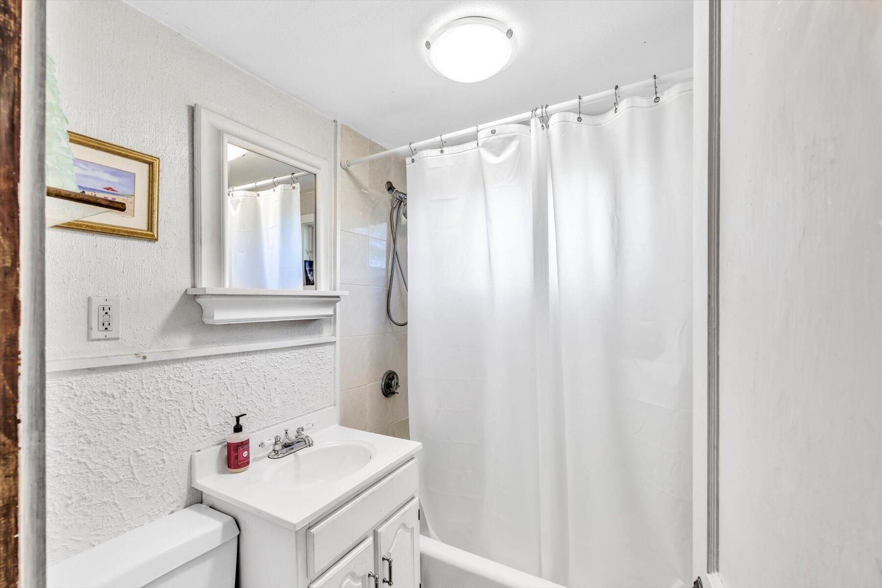 2 Rita Mary Street West Dennis, MA 02670 - Photo 29 of 39 a bathroom with a sink vanity and a mirror