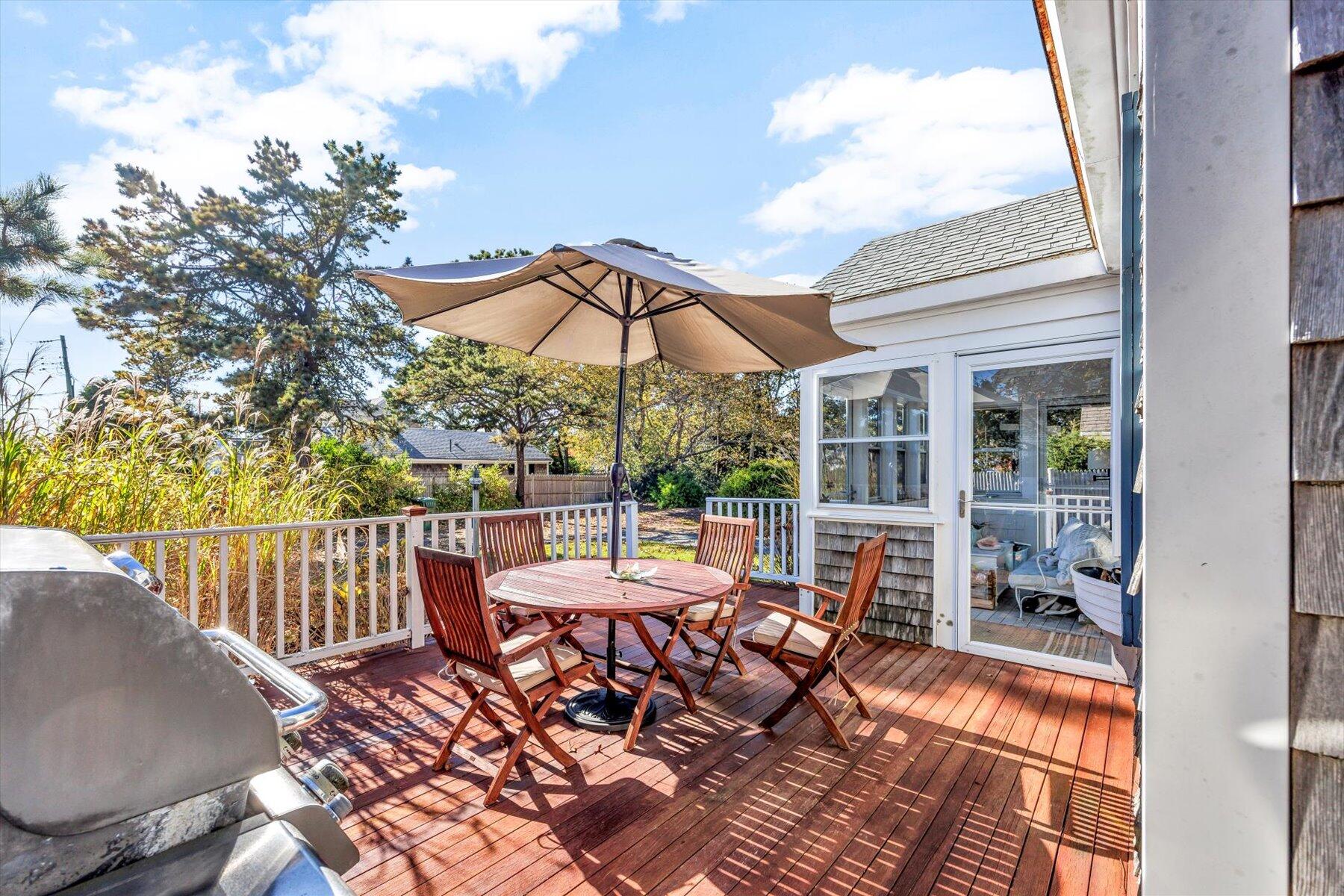2 Rita Mary Street West Dennis, MA 02670 - Photo 6 of 39 a view of a patio with a table chairs and backyard