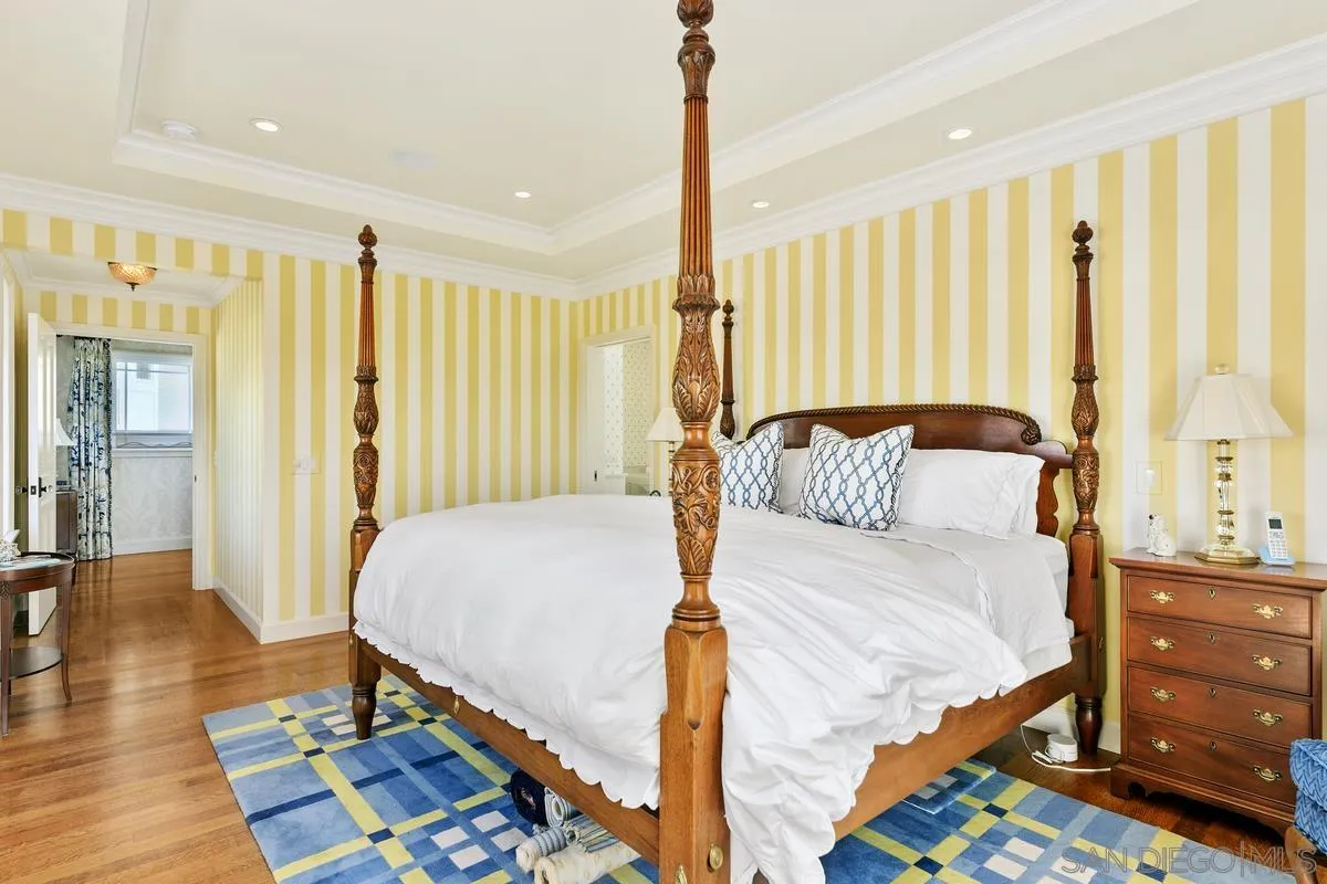 2254 Del Mar Heights Road Del Mar, CA 92014 - Photo 17 of 34 a bedroom with a bed and wooden floor