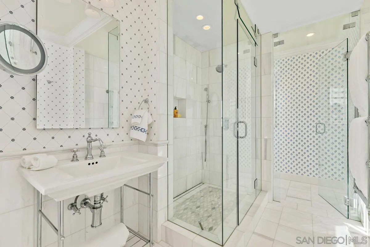 2254 Del Mar Heights Road Del Mar, CA 92014 - Photo 23 of 34 a bathroom with a shower sink and mirror