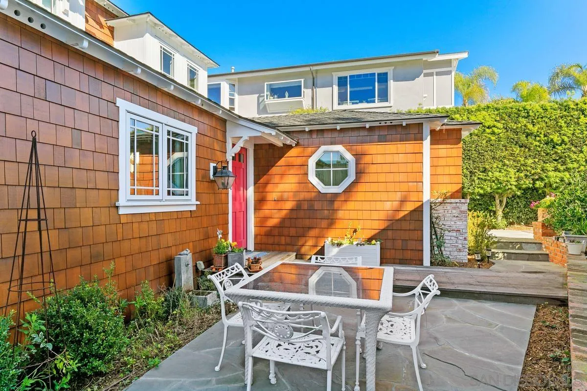 2254 Del Mar Heights Road Del Mar, CA 92014 - Photo 3 of 34 a backyard of a house with table and chairs