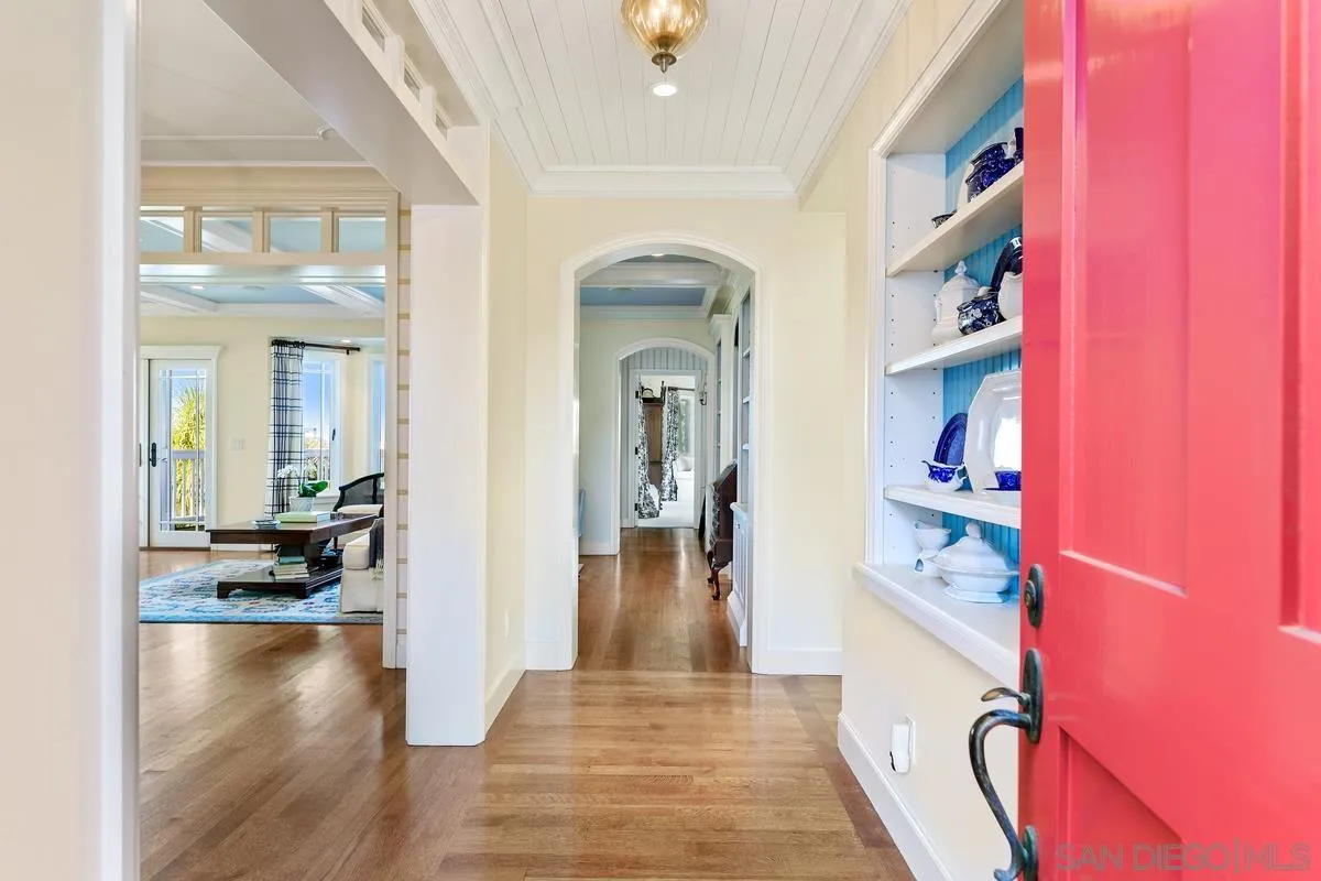 2254 Del Mar Heights Road Del Mar, CA 92014 - Photo 5 of 34 a view of a hallway view with living room and wooden floor