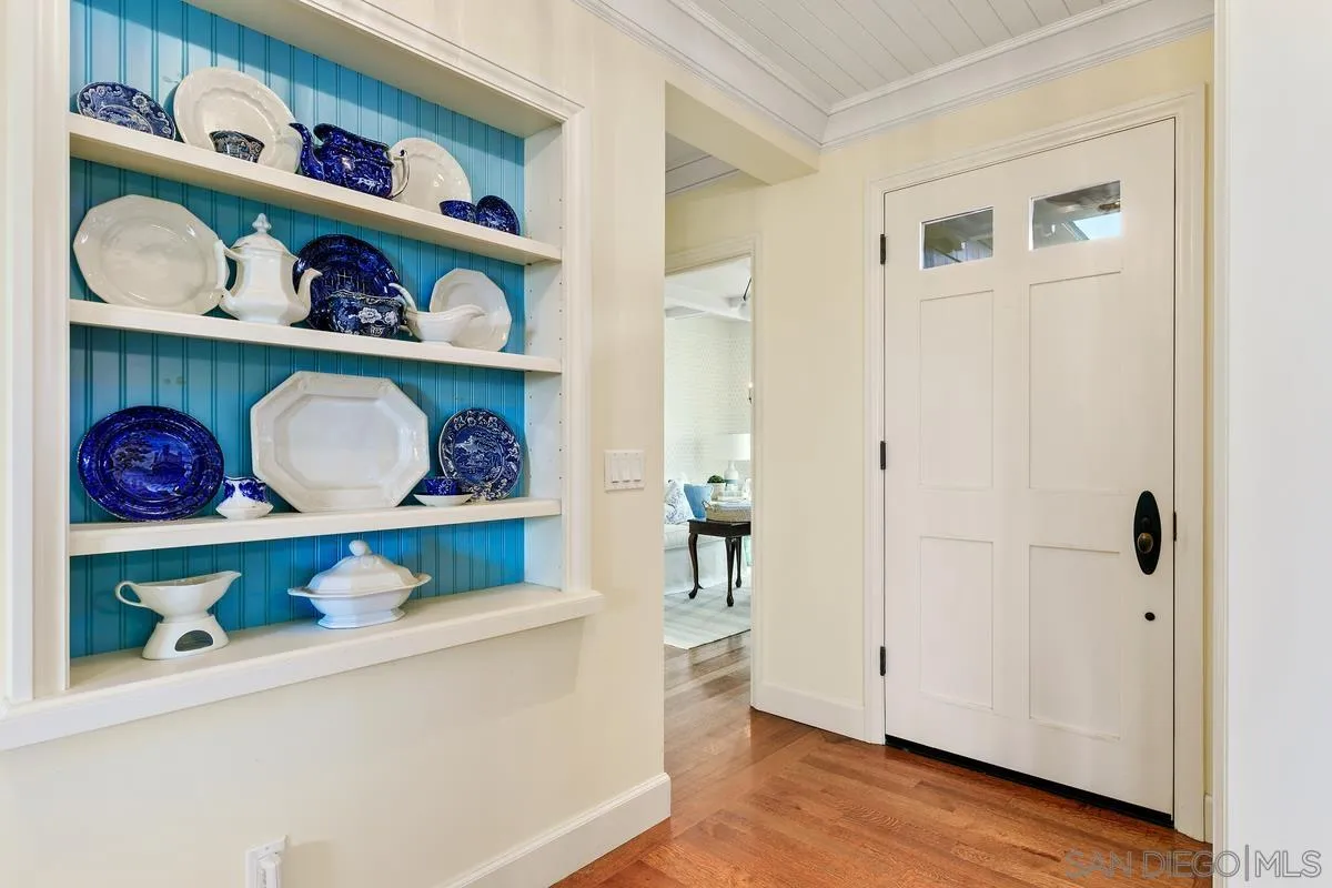 2254 Del Mar Heights Road Del Mar, CA 92014 - Photo 6 of 34 a shelf with books and knick knacks on it