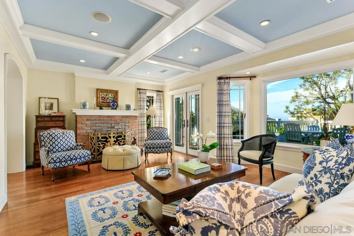2254 Del Mar Heights Road Del Mar, CA 92014 - Photo 7 of 34 a living room with fireplace furniture and a large window