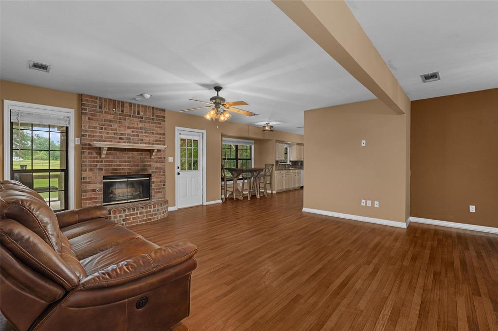 9720 Locust Hill Road Greenwood, LA 71033 - Photo 12 of 31 a living room with furniture and a fireplace