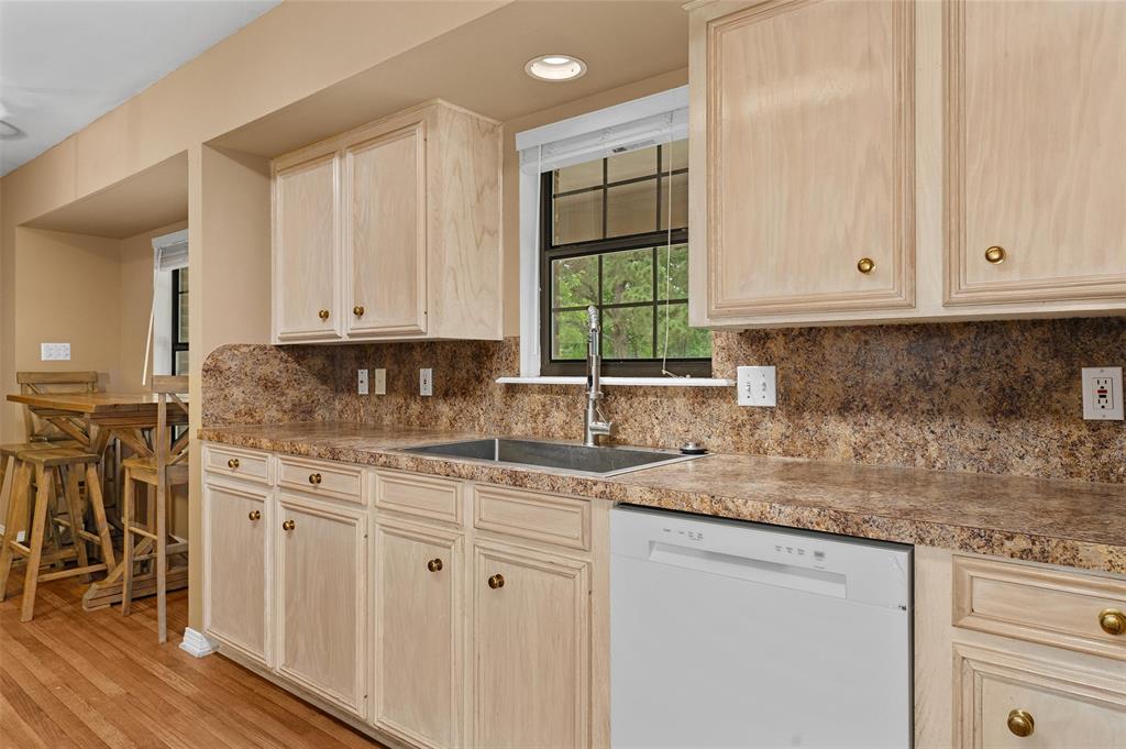 9720 Locust Hill Road Greenwood, LA 71033 - Photo 16 of 31 a kitchen with stainless steel appliances granite countertop a sink stove and cabinets
