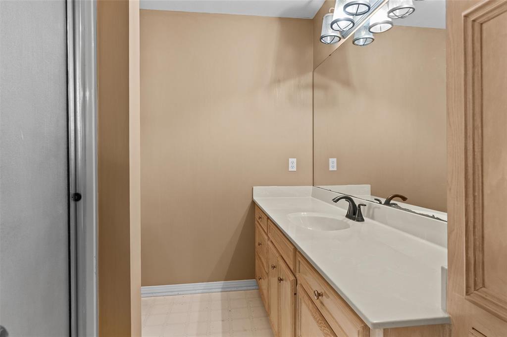 9720 Locust Hill Road Greenwood, LA 71033 - Photo 22 of 31 a bathroom with a sink and mirror