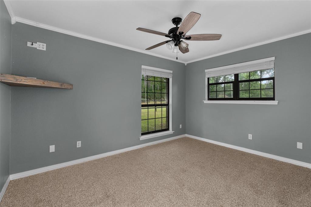 9720 Locust Hill Road Greenwood, LA 71033 - Photo 24 of 31 a view of a big room with windows and ceiling fan