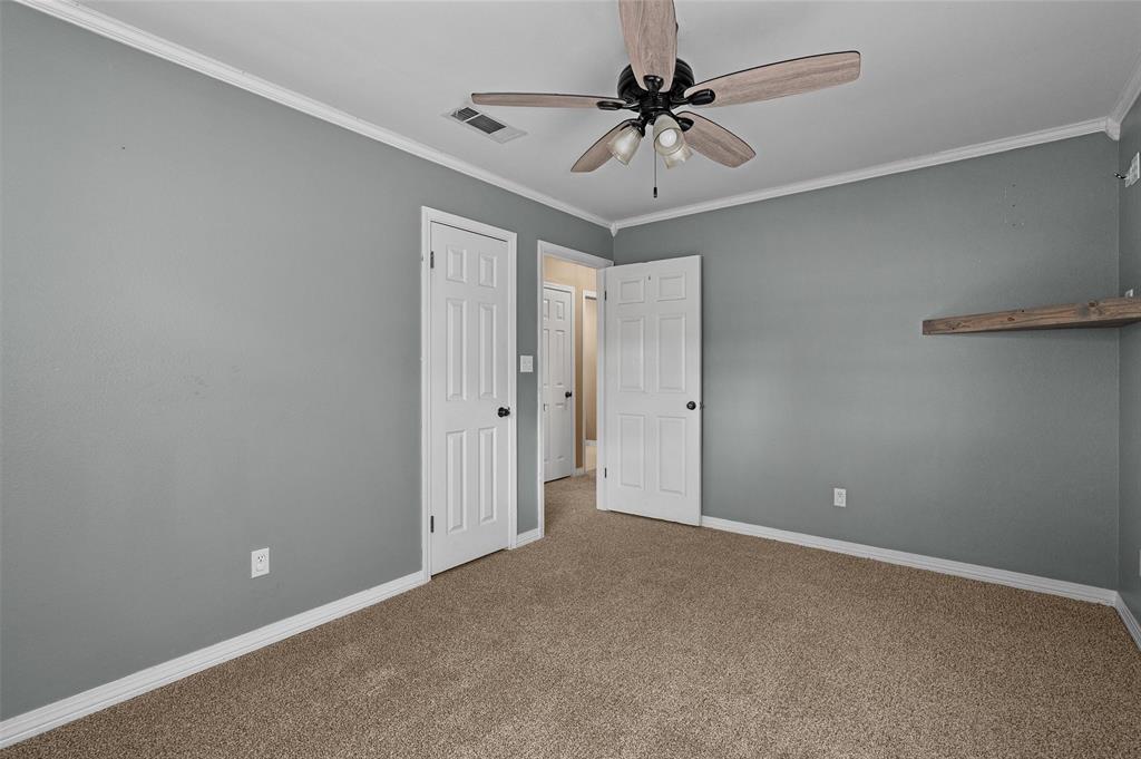 9720 Locust Hill Road Greenwood, LA 71033 - Photo 25 of 31 a view of an empty room and a chandelier fan