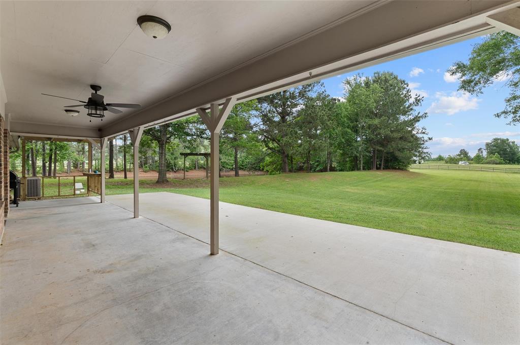 9720 Locust Hill Road Greenwood, LA 71033 - Photo 28 of 31 a view of a porch with a yard