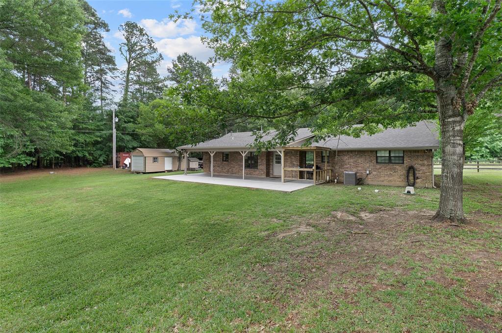 9720 Locust Hill Road Greenwood, LA 71033 - Photo 31 of 31 a view of a house with a backyard