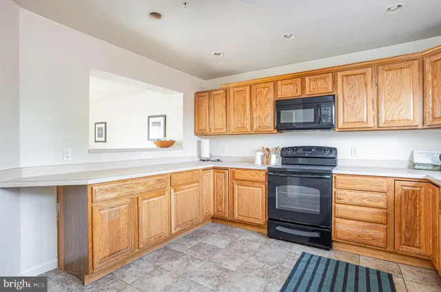 a kitchen with stainless steel appliances granite countertop a stove and a sink