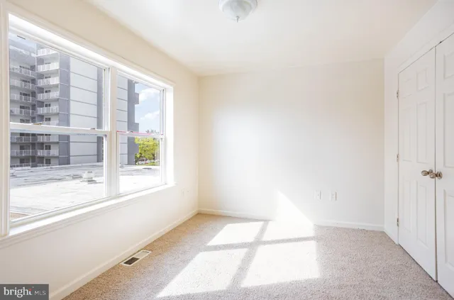 a view of an empty room and window