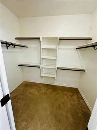 a room with a wooden shelf